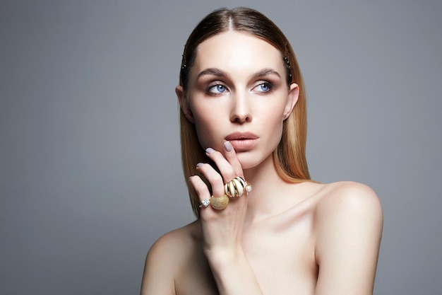 Beautiful girl with jewelry on her hand