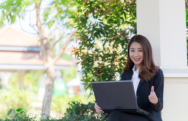 Beautiful girl with laptop to work.