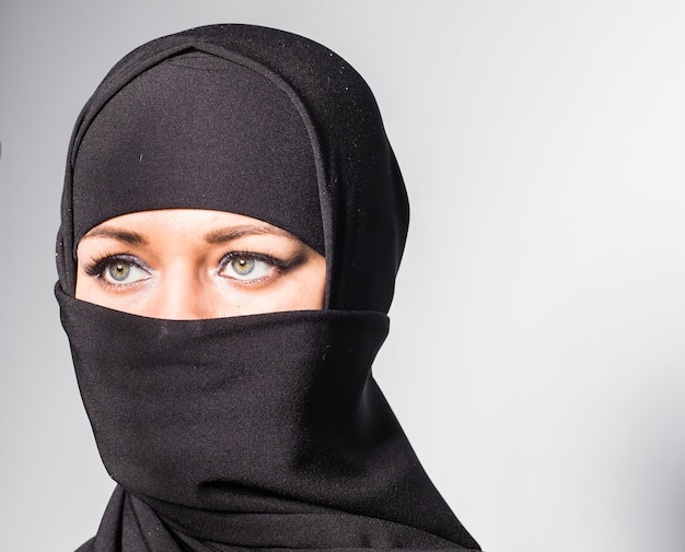 Beautiful girl with a scarf and black veil