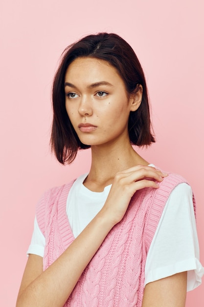 Beautiful girl with short hair and a pink sweater Lifestyle unaltered