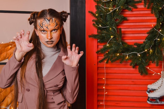 A beautiful girl with a tiger makeup New year concept Year of the tiger