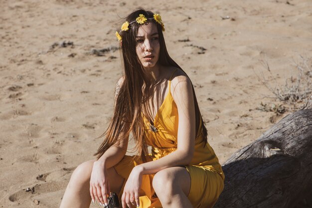 Beautiful girl in the yellow dress