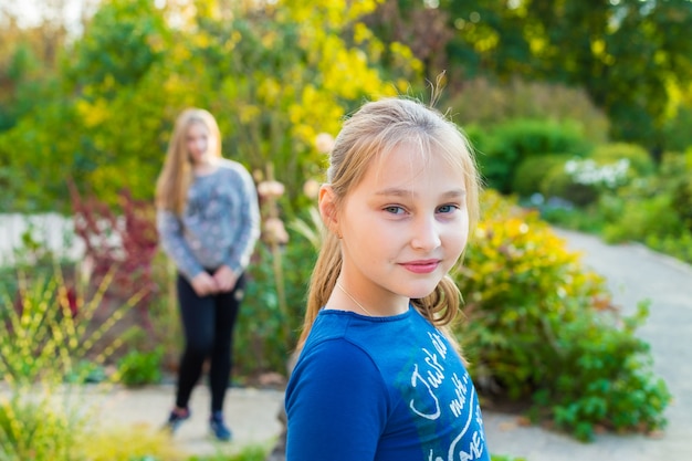 Beautiful girls walking in the summer park