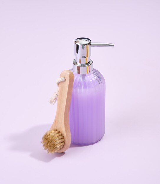 Premium Photo A beautiful glass dispenser with purple liquid soap and