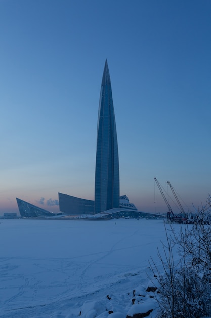 Beautiful glass tower in the winter evening.