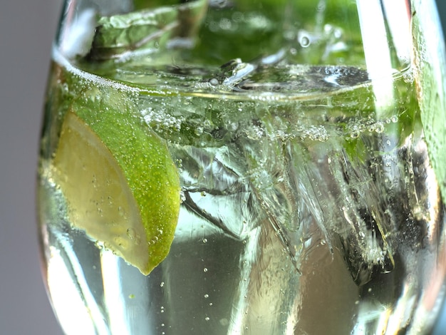 Beautiful glass with a refreshing mojito standing on a table