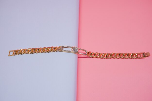 beautiful gold bracelet with peach background