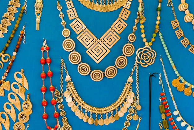 Beautiful gold jewelry on blue background