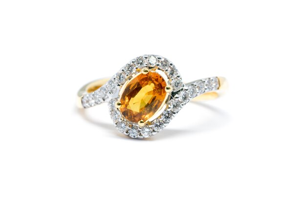 beautiful Gold ring with diamond and yellow sapphire isolated on white background, wedding ring and 