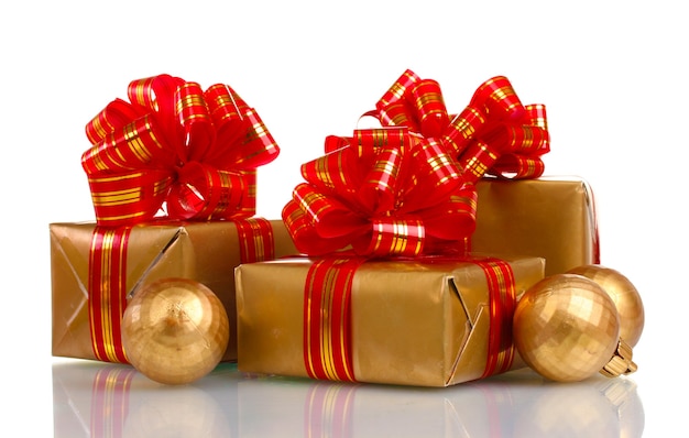 Beautiful golden gifts with red ribbon and Christmas balls isolated 