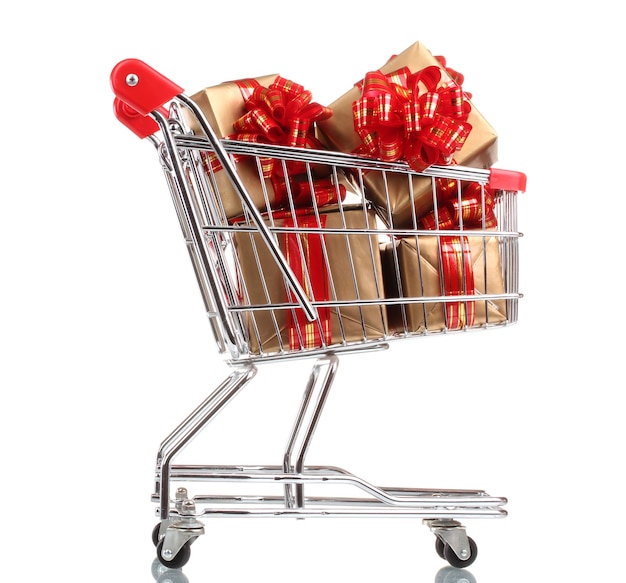 Beautiful golden gifts with red ribbon in shopping cart isolated on white surface