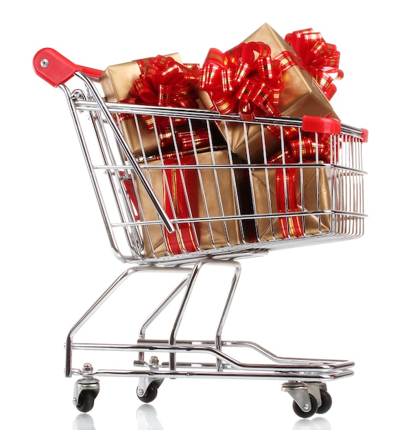 Beautiful golden gifts with red ribbon in shopping cart isolated on white