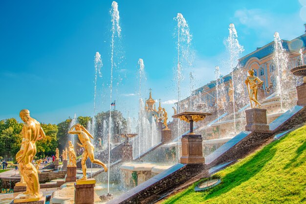 Beautiful golden sculptures in the grand cascade fountain in peterhof peterhof st petersburg russia september 12 2023