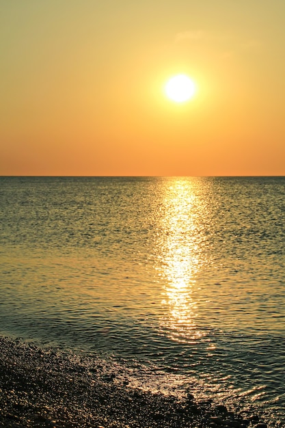 Beautiful golden sunrise as seen from the gravel beach at Rhodes, Greece