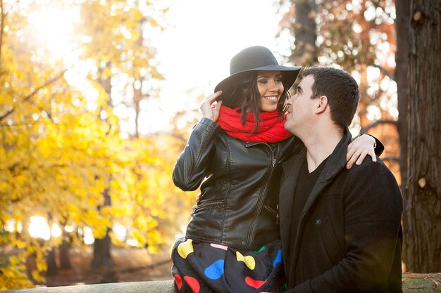 Beautiful gourgeous couple in autumn park having good time