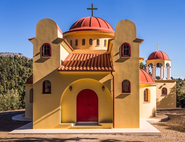 Beautiful Greek church on a sunny day in the mountains on an island Evia in Greece