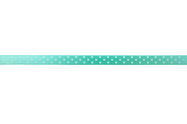 Photo beautiful green ribbon with polka dot pattern on white background