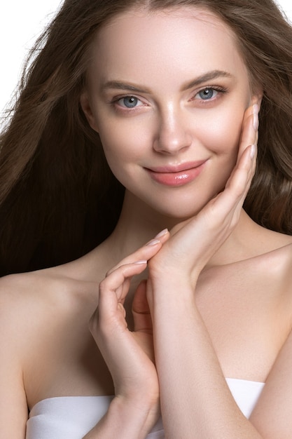 Beautiful hair and skin woman face model beauty concept cosmetic. Studio shot.
