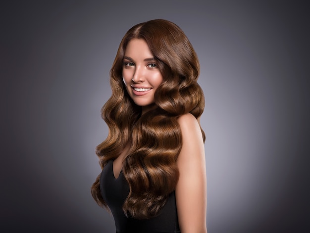 Beautiful hair woman curly hairstyle female. Studio shot.