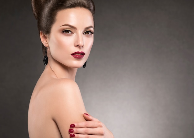 Beautiful hairstyle woman beauty hair fashion makeup red lipstick. Studio shot.