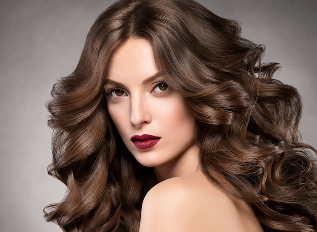 Beautiful hairstyle woman beauty hair fashion makeup red lipstick. Studio shot.