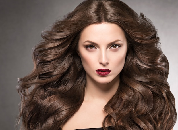 Beautiful hairstyle woman beauty hair fashion makeup red lipstick. Studio shot.