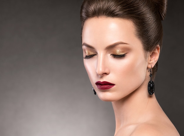 Beautiful hairstyle woman beauty hair fashion makeup red lipstick. Studio shot.