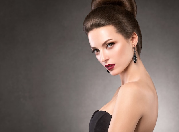 Beautiful hairstyle woman beauty hair fashion makeup red lipstick. Studio shot.