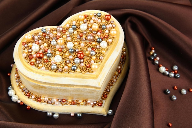 Beautiful hand made casket, on silk background