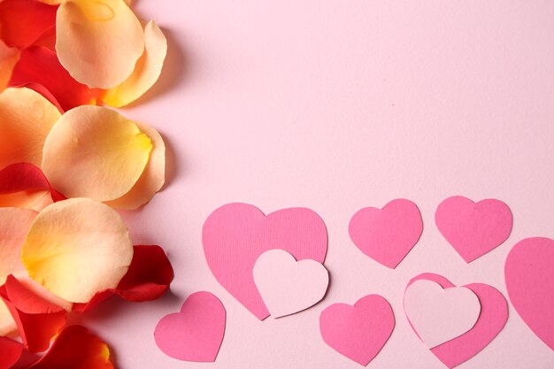 Beautiful hand made post card with hearts and rose petals, close-up