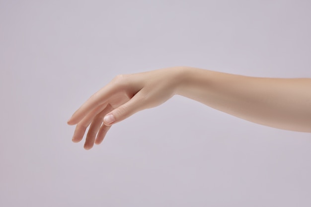 Beautiful hand with delicate gesture isolated