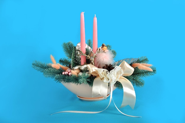 Beautiful handmade Christmas tree composition with two candles a