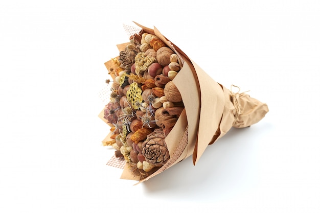 Beautiful handmade gift made of nuts and dried flowers