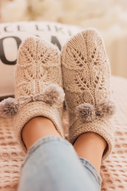 Beautiful handmade knitted socks on woman legs