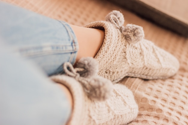 Beautiful handmade knitted socks on woman legs