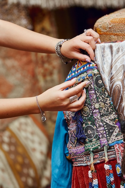 Beautiful handmade turkish carpets and bedspreads, textiles in\
a shop on the street in turkey