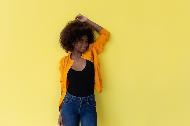  beautiful and happy African American on a yellow background