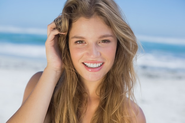 Beautiful happy blonde on the beach