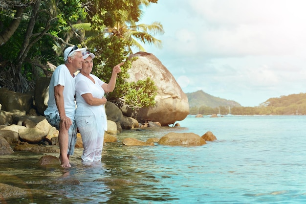 Beautiful happy elderly couple rest at tropical resort