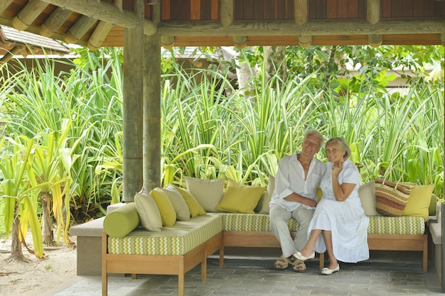 Beautiful happy elderly couple rest at tropical resort