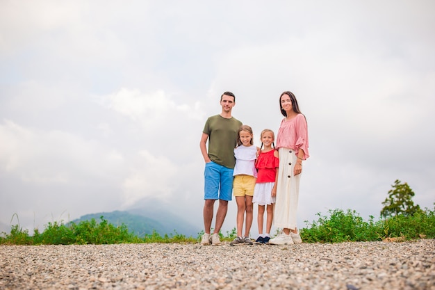 Beautiful happy family in mountains