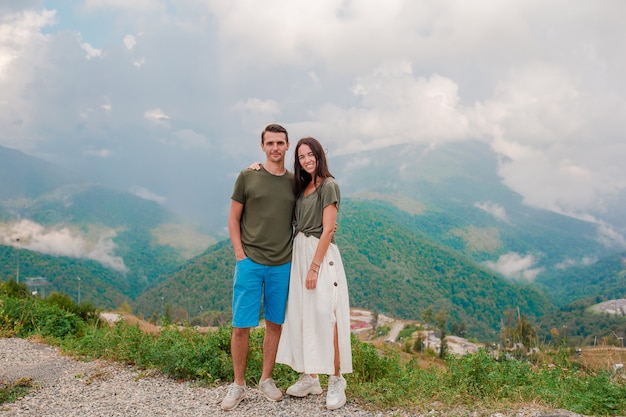 Beautiful happy family in mountains