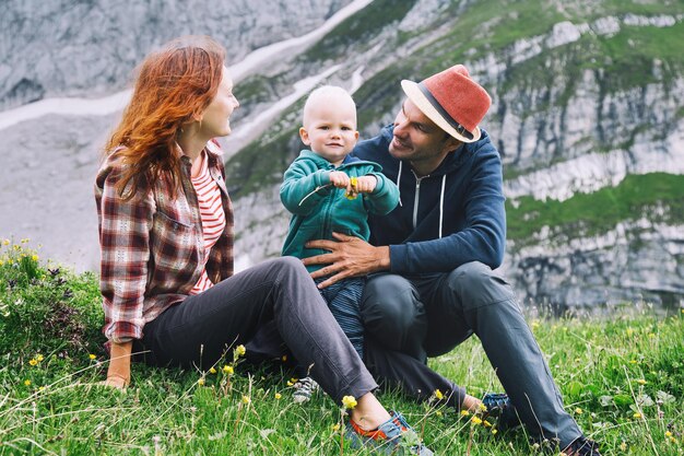 Beautiful happy family spends time on nature in the mountains Family background