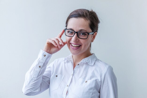 Beautiful happy girl smiling in eyeglasses 