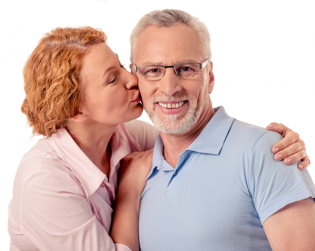 Beautiful happy mature couple is looking at camera.