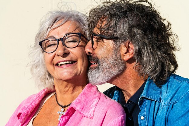 Beautiful happy senior couple bonding outdoors