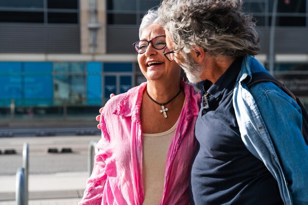 Beautiful happy senior couple bonding outdoors