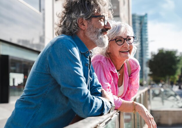 Beautiful happy senior couple bonding outdoors