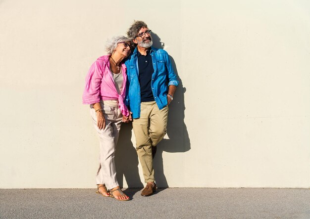 Beautiful happy senior couple bonding outdoors