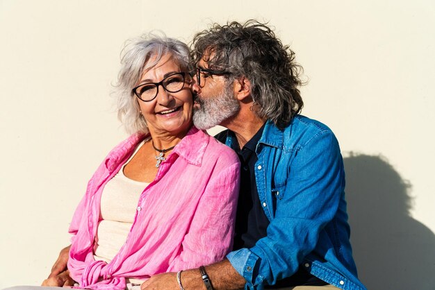 Beautiful happy senior couple bonding outdoors